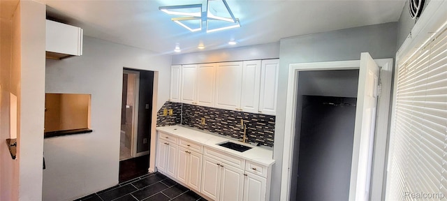 18978 Indiana St, Detroit, MI 48221 - kitchen with tasteful backsplash, light countertops, white cabinetry, dark tile patterned flooring, and recessed lighting