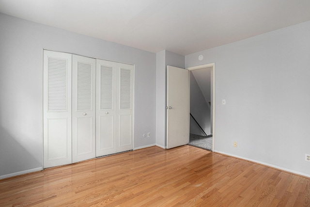 3539 Kenbrooke Ct, Kalamazoo, MI 49006 - unfurnished bedroom with light wood finished floors and a closet