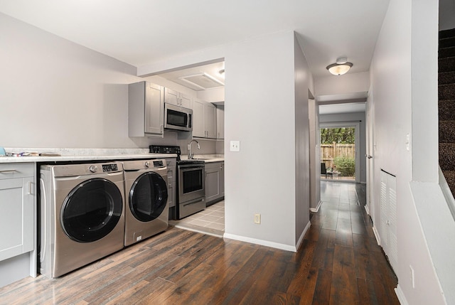 3539 Kenbrooke Ct, Kalamazoo, MI 49006 - washroom featuring washing machine and clothes dryer and wood finished floors
