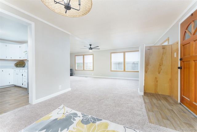 5806 Commanche Ln, Howell, MI 48843 - entryway featuring light colored carpet, a ceiling fan, a chandelier, and light wood-style floors