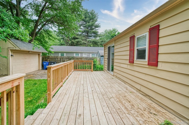 5806 Commanche Ln, Howell, MI 48843 - wooden deck featuring an outbuilding and a detached garage
