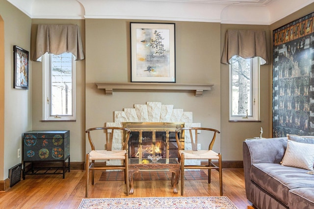 1506 Shadford Rd, Ann Arbor, MI 48104 - dining space with wood finished floors, ornamental molding, and a glass covered fireplace