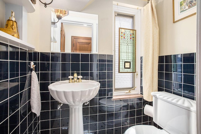 1506 Shadford Rd, Ann Arbor, MI 48104 - bathroom featuring tile walls and a wainscoted wall