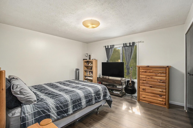 4760 Briarhill Dr, Portage, MI 49024 - bedroom featuring wood finished floors and a textured ceiling