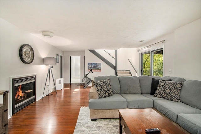4760 Briarhill Dr, Portage, MI 49024 - living area featuring wood finished floors, a glass covered fireplace, and stairway
