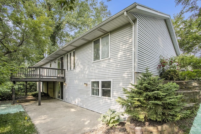 4760 Briarhill Dr, Portage, MI 49024 - view of property exterior featuring a wooden deck and a patio area