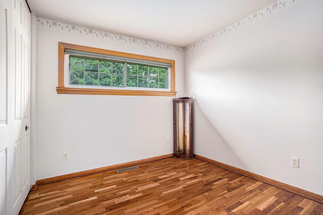 201 Beaumont Dr, Battle Creek, MI 49014 - spare room with wood finished floors and baseboards
