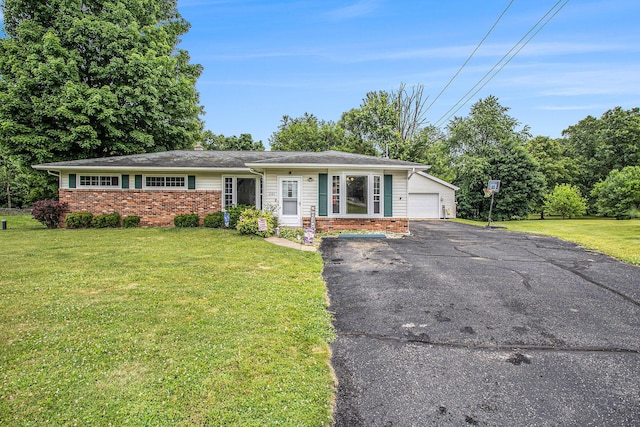 201 Beaumont Dr, Battle Creek, MI 49014 - ranch-style house with a front lawn, brick siding, a garage, and asphalt driveway