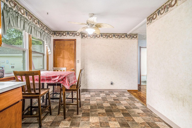 201 Beaumont Dr, Battle Creek, MI 49014 - dining area with ceiling fan and stone finish flooring
