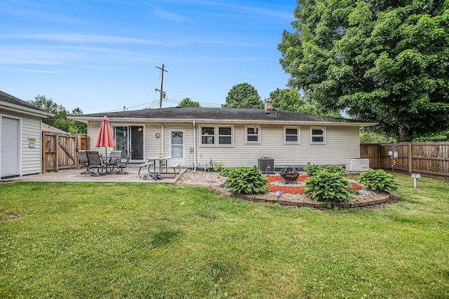 201 Beaumont Dr, Battle Creek, MI 49014 - back of property with a patio area, a fenced backyard, and a gate