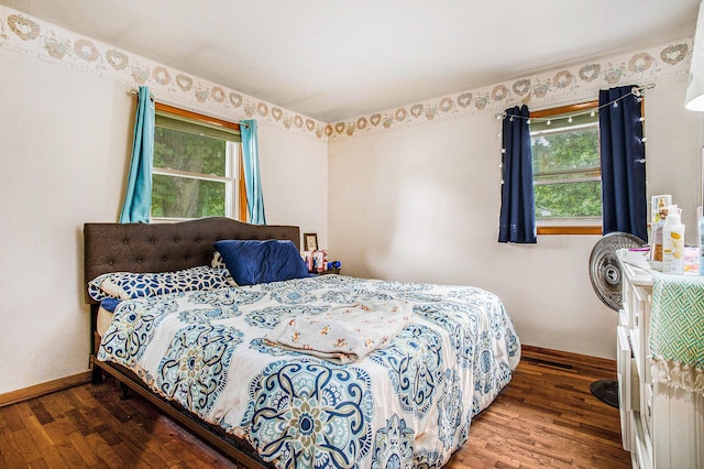 201 Beaumont Dr, Battle Creek, MI 49014 - bedroom featuring wood finished floors and multiple windows