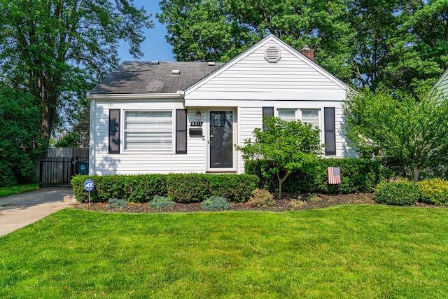 4211 Oakshire Ave, Berkley, MI 48072 - view of front of property featuring a chimney, a front lawn, and a shingled roof