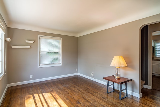 4211 Oakshire Ave, Berkley, MI 48072 - empty room featuring dark wood-style floors and arched walkways