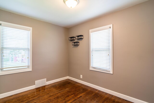 4211 Oakshire Ave, Berkley, MI 48072 - spare room with healthy amount of natural light and dark wood-style flooring
