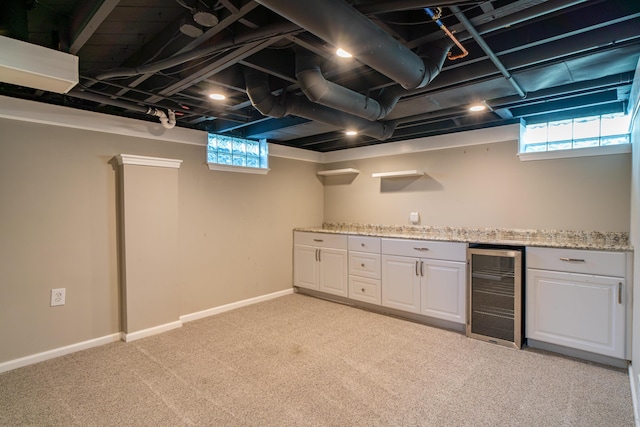 4211 Oakshire Ave, Berkley, MI 48072 - below grade area with wine cooler, light colored carpet, and a bar