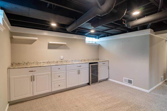 4211 Oakshire Ave, Berkley, MI 48072 - indoor dry bar with beverage cooler and light colored carpet
