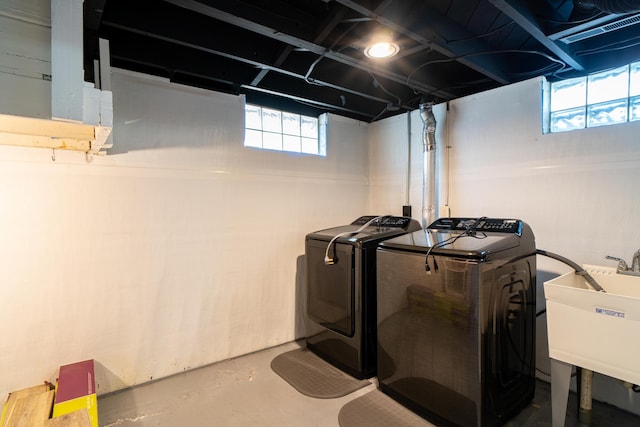4211 Oakshire Ave, Berkley, MI 48072 - below grade area featuring separate washer and dryer and healthy amount of natural light