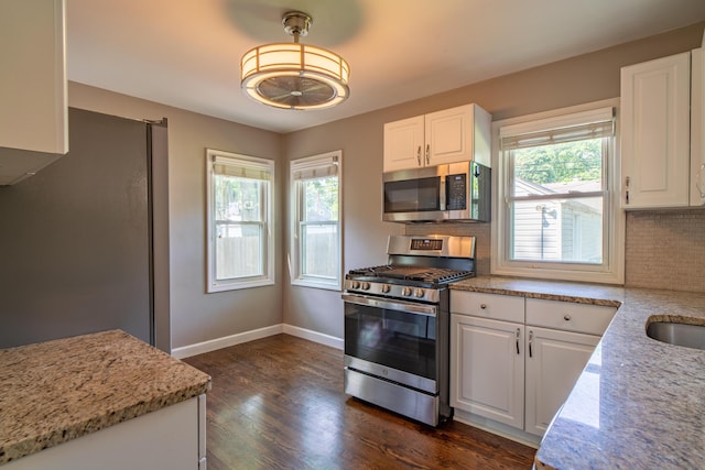 4211 Oakshire Ave, Berkley, MI 48072 - kitchen with appliances with stainless steel finishes, healthy amount of natural light, and white cabinets
