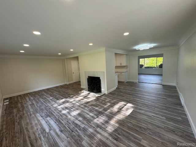 28670 Inkster Rd, Southfield, MI 48034 - unfurnished living room with ornamental molding, dark wood-style floors, recessed lighting, and a fireplace with flush hearth