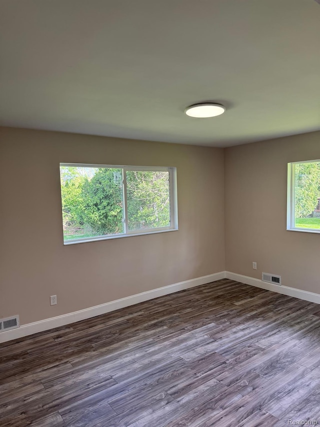 28670 Inkster Rd, Southfield, MI 48034 - empty room featuring baseboards and dark wood-style floors