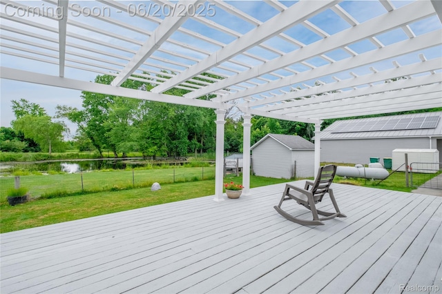 8420 Beers Rd, Swartz Creek, MI 48473 - wooden deck featuring a water view, a pergola, a storage shed, and view of scattered trees