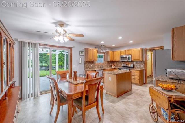 8420 Beers Rd, Swartz Creek, MI 48473 - dining room featuring a ceiling fan and recessed lighting