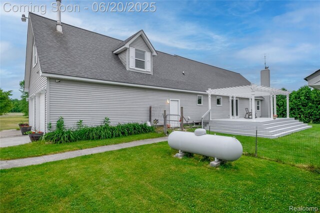 8420 Beers Rd, Swartz Creek, MI 48473 - back of property featuring a pergola, a yard, roof with shingles, and a chimney
