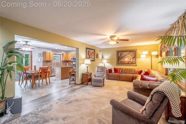 8420 Beers Rd, Swartz Creek, MI 48473 - living area with a ceiling fan and light wood-style floors