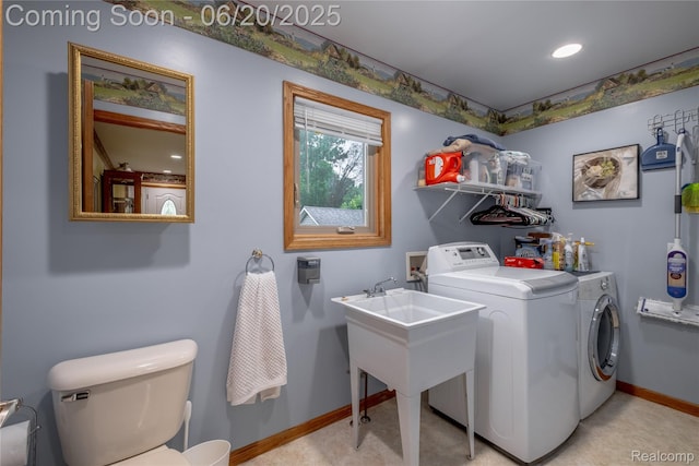 8420 Beers Rd, Swartz Creek, MI 48473 - laundry area with washer and clothes dryer and light colored carpet