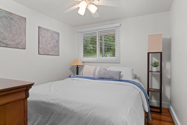 3184 N Lakeshore Dr, Hillsdale, MI 49242 - bedroom featuring wood finished floors and a ceiling fan