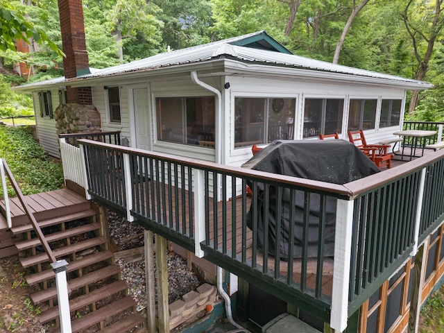 3184 N Lakeshore Dr, Hillsdale, MI 49242 - wooden terrace featuring a grill, a view of trees, and stairway