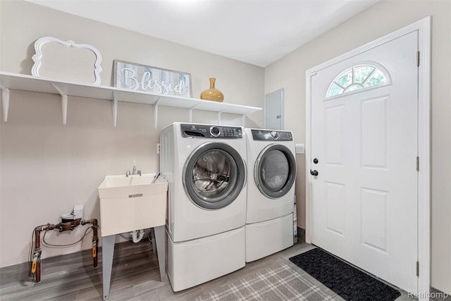 4981 Harding St, Dearborn Heights, MI 48125 - laundry room featuring washing machine and clothes dryer and light wood-type flooring