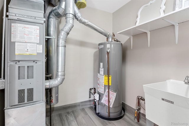 4981 Harding St, Dearborn Heights, MI 48125 - utility room featuring water heater and heating unit