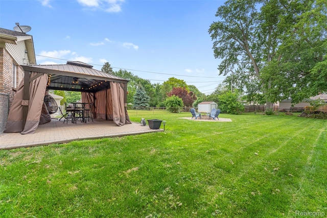 4981 Harding St, Dearborn Heights, MI 48125 - fenced backyard featuring a gazebo and a storage unit