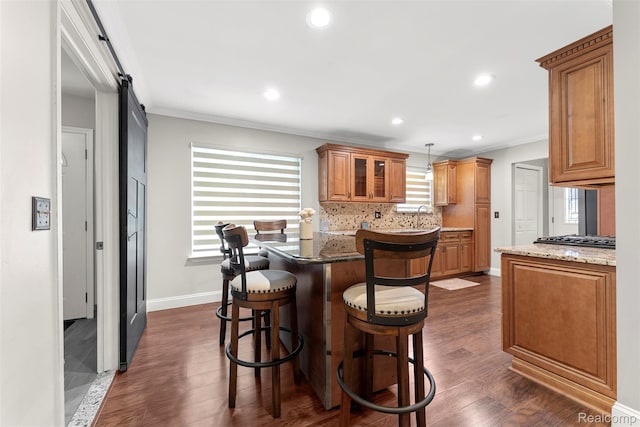 4981 Harding St, Dearborn Heights, MI 48125 - kitchen featuring ornamental molding, a kitchen breakfast bar, dark wood-style flooring, tasteful backsplash, and recessed lighting