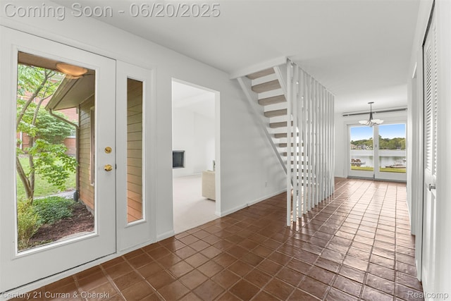 3150 Wellington Ct, West Bloomfield, MI 48324 - unfurnished room featuring a chandelier and a water view