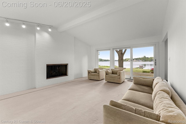 3150 Wellington Ct, West Bloomfield, MI 48324 - carpeted living room with a water view, a fireplace, and rail lighting