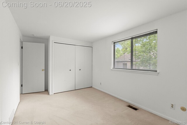 3150 Wellington Ct, West Bloomfield, MI 48324 - unfurnished bedroom with carpet floors and a closet