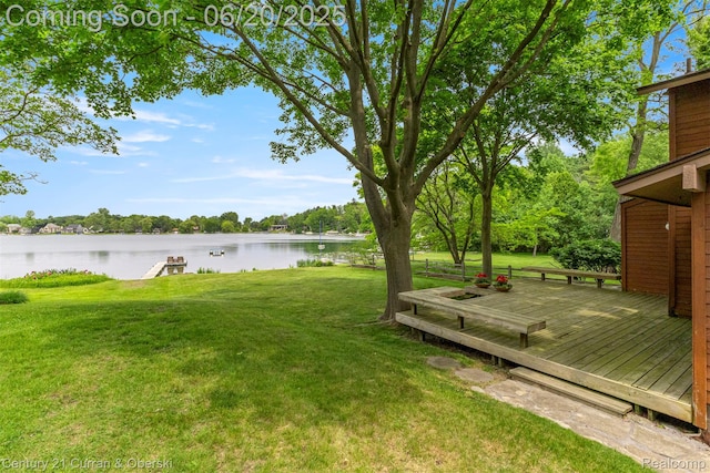 3150 Wellington Ct, West Bloomfield, MI 48324 - view of grassy yard with a deck with water view