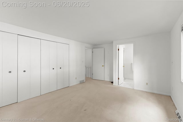 3150 Wellington Ct, West Bloomfield, MI 48324 - unfurnished bedroom with carpet, a closet, and ensuite bath