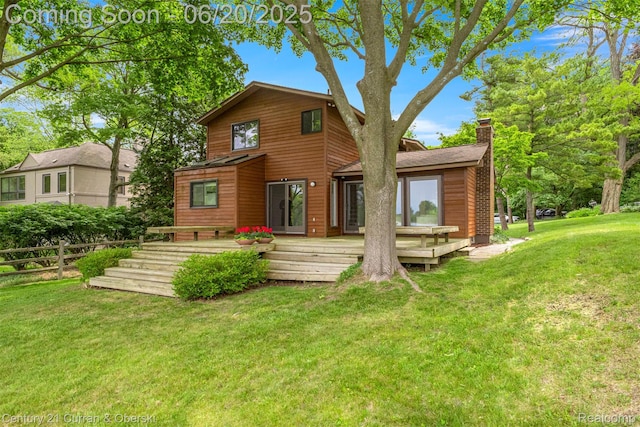 3150 Wellington Ct, West Bloomfield, MI 48324 - rear view of property featuring a chimney and a wooden deck