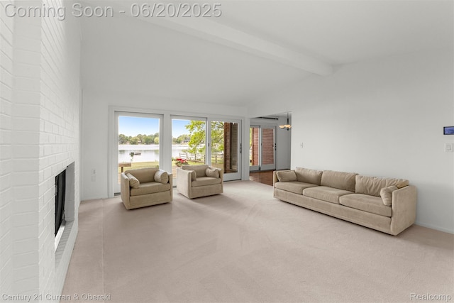 3150 Wellington Ct, West Bloomfield, MI 48324 - carpeted living area with a brick fireplace and a water view
