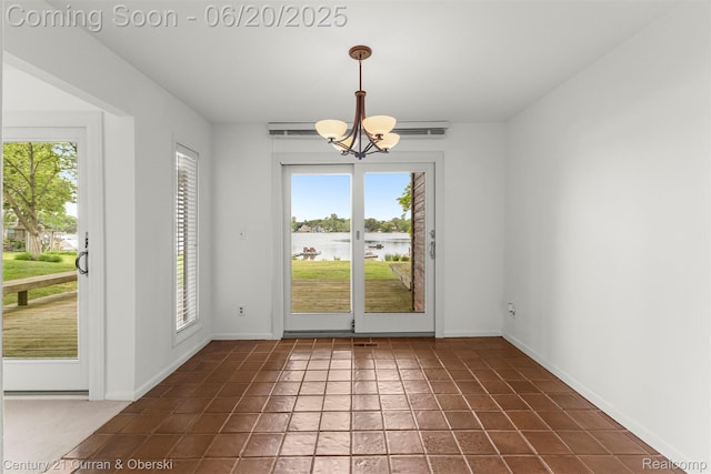 3150 Wellington Ct, West Bloomfield, MI 48324 - unfurnished dining area featuring healthy amount of natural light, a chandelier, and a water view