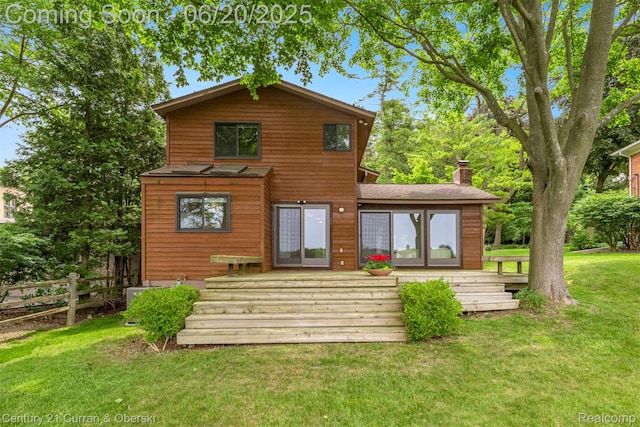 3150 Wellington Ct, West Bloomfield, MI 48324 - rear view of house featuring a wooden deck and a chimney