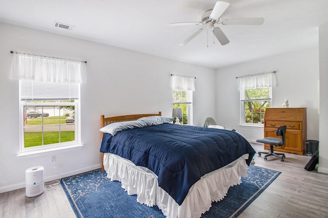 749 W Barrington Cir, Jackson, MI 49203 - bedroom with wood finished floors and a ceiling fan