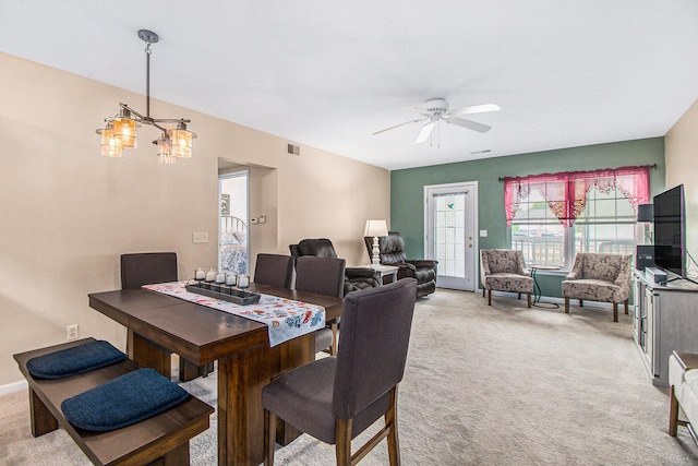 749 W Barrington Cir, Jackson, MI 49203 - dining space with light carpet, a chandelier, and a ceiling fan