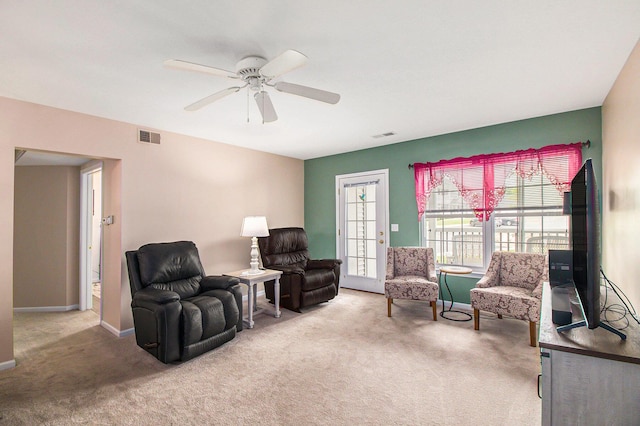 749 W Barrington Cir, Jackson, MI 49203 - living area featuring carpet floors and a ceiling fan