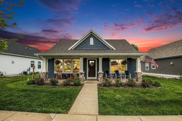 964 Everett Pkwy, South Haven, MI 49090 - craftsman-style house with a porch, a front lawn, and a shingled roof