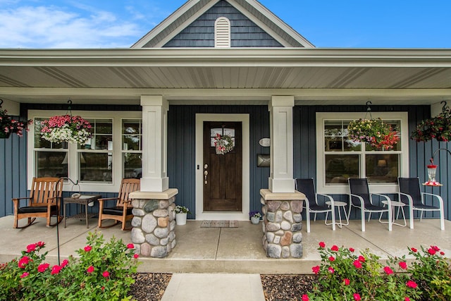 964 Everett Pkwy, South Haven, MI 49090 - view of exterior entry featuring a porch and board and batten siding