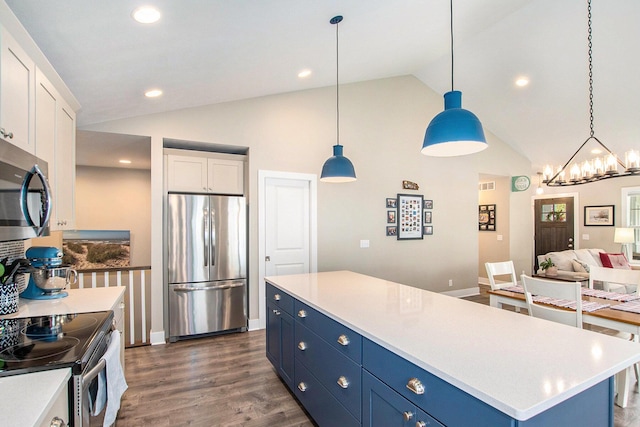964 Everett Pkwy, South Haven, MI 49090 - kitchen featuring stainless steel appliances, blue cabinets, vaulted ceiling, white cabinets, and a chandelier